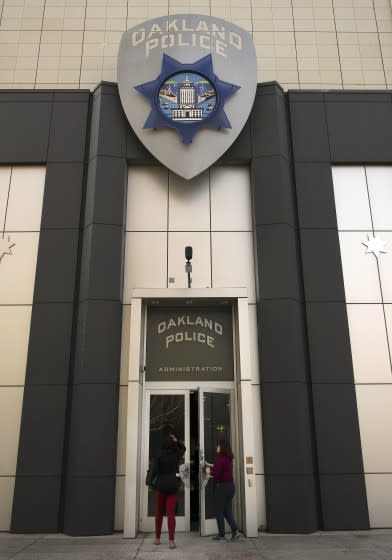 Women enter the Oakland Police building on Wednesday, Jan. 31, 2018, in Oakland, Calif. (AP Photo/Ben Margot)