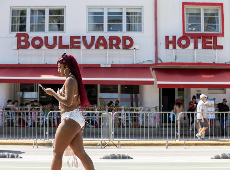 A girl makes her way down Ocean Drive near the Boulevard Hotel during spring break on Friday, March 15, 2024, in Miami Beach. 