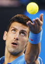 Novak Djokovic of Serbia serves against Milos Raonic of Canada during their men's singles quarter-final match at the Australian Open 2015 tennis tournament in Melbourne January 28, 2015. REUTERS/Athit Perawongmetha (AUSTRALIA - Tags: SPORT TENNIS)