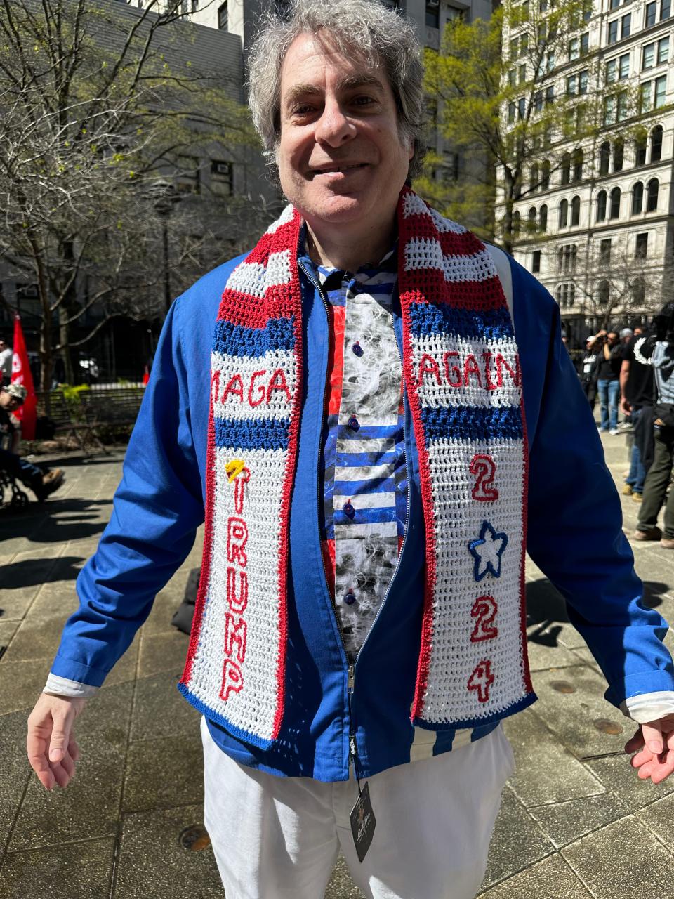 Steve Merczynski of New York shows his scarf during a pro-Trump protest in New York on April 15, 2024, the first day of the former president's secret trial.