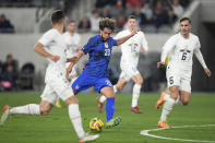 United States forward Cade Cowell (20) shoots during the first half of an international friendly soccer match against Serbia in Los Angeles, Wednesday, Jan. 25, 2023. (AP Photo/Ashley Landis)