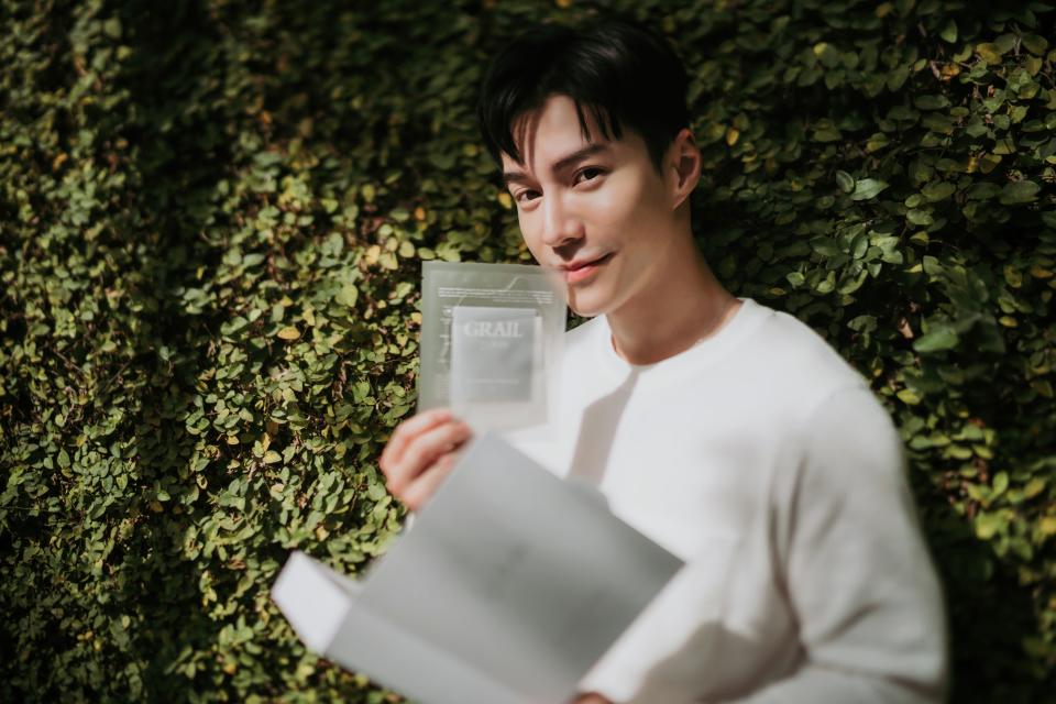 Actor Lawrence Wong with a product from his skincare brand, Grail. (Photo: Grail)