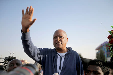 Merera Gudina, leader of the Oromo Federalist Congress party waves to his supporters after his release from prison in Addis Ababa, Ethiopia January 17, 2018. REUTERS/Tiksa Negeri