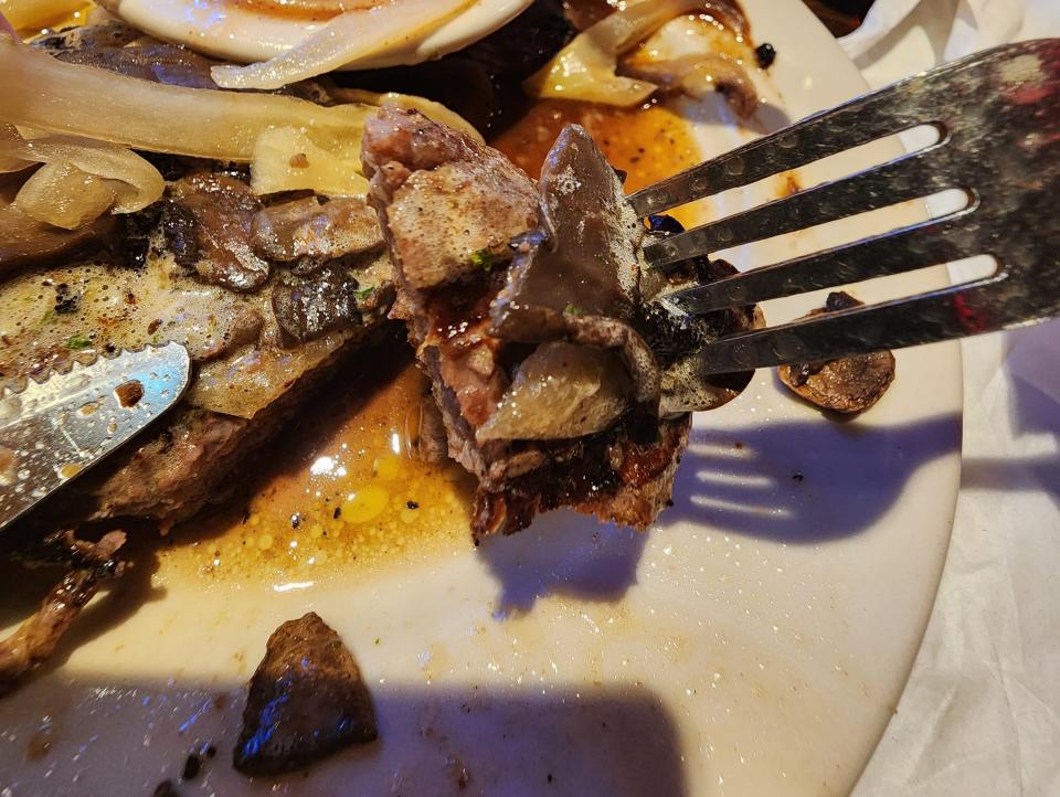 Piece of steak on fork at Logan's Roadhouse