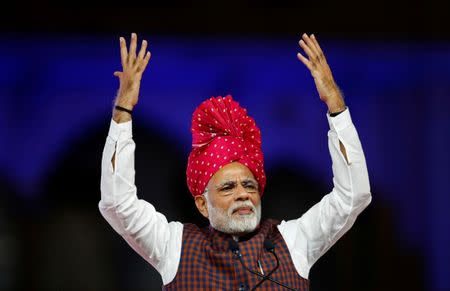 India's Prime Minister Narendra Modi gestures as he addresses his supporters during an election campaign meeting ahead of Gujarat state assembly elections, in Ahmedabad, December 3, 2017. REUTERS/Amit Dave/FilesRC1DE9DE1C40