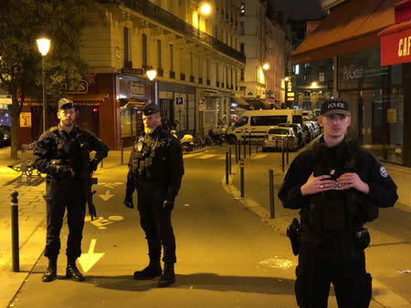 French police secure a street after a man killed a passer-by in a knife attack in the heart of Paris and injured four others before being shot dead by police, according to French authorities in Paris, France, May 12, 2018. REUTERS/Lucien Libert