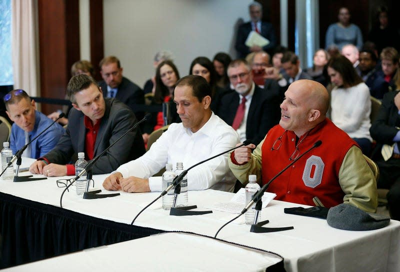 Victims of former Ohio State team doctor Dr. Richard Strauss, Michael DiSabato, from right, with Mike Schyck, Brian Garrett and Stephen Snyder Hill, speak during an Ohio State University Board of Trustees meeting at the Longaberger Alumni House in Columbus, Ohio in November 2018. 