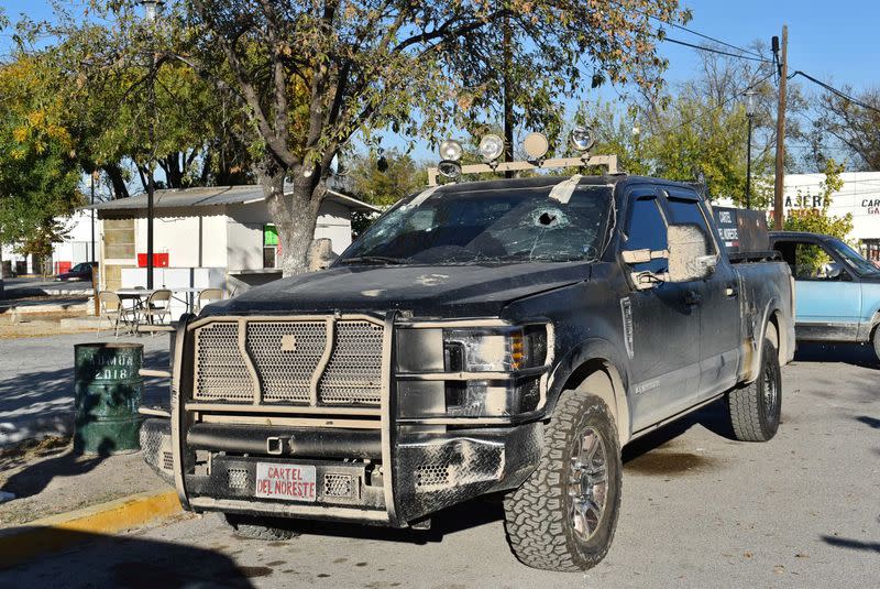 A bullet-riddled pick-up truck is pictured after clashes sparked by suspected cartel gunmen in a northern Mexican town that killed 20 people this weekend, in Villa Union, Coahuila