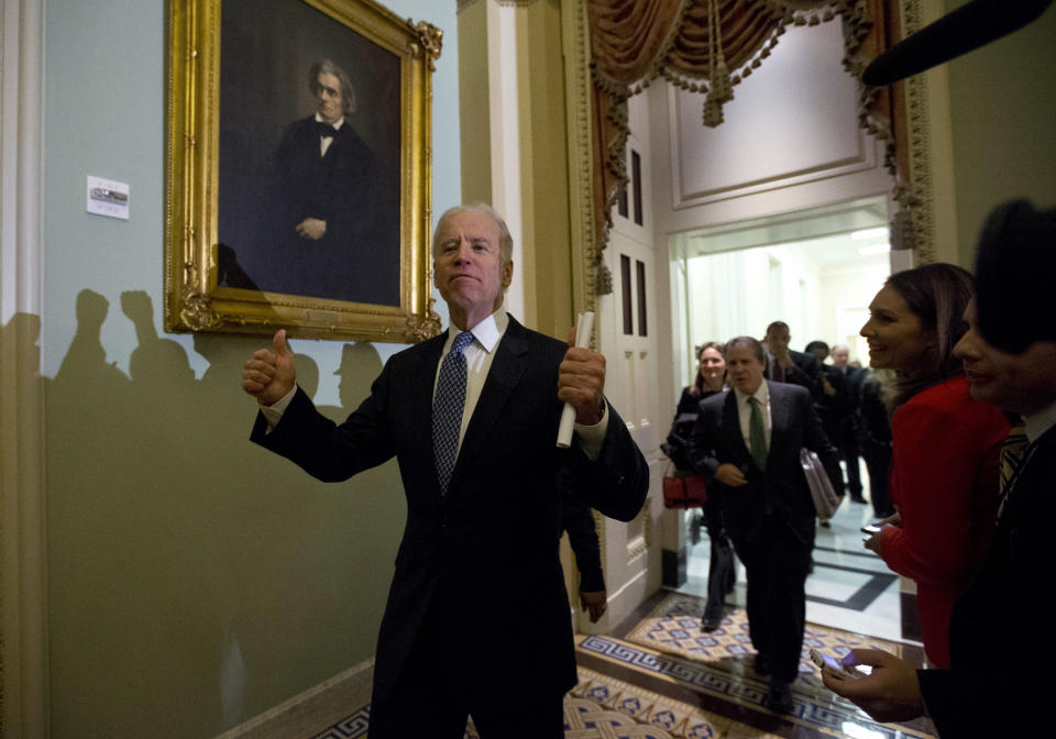 FILE - In this Dec. 31, 2012, file photo Vice President Joe Biden gives two thumbs up following a Senate Democratic caucus meeting about the fiscal cliff on Capitol Hill in Washington. (AP Photo/Alex Brandon, File)