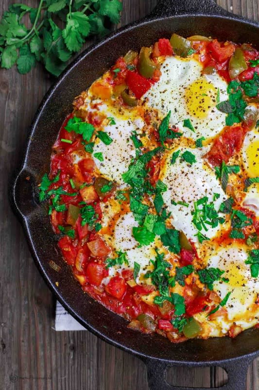 <p>The Mediterranean Dish</p><p>Eggs are gently poached in a simmering mixture of tomatoes, bell peppers, onions, and garlic with spices and herbs for a satisfying one-skillet dish.</p><p><strong>Get the recipe: <a href="https://www.themediterraneandish.com/shakshuka-recipe/" rel="nofollow noopener" target="_blank" data-ylk="slk:Shakshuka;elm:context_link;itc:0;sec:content-canvas" class="link ">Shakshuka</a></strong></p>