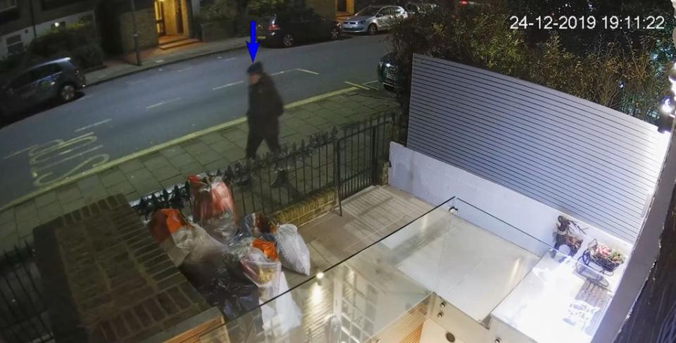 CCTV grab of a man wearing dark clothing outside the home of Flamur Beqiri (Metropolitan Police/PA) (PA Media)