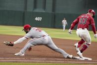 Arizona Diamondbacks' Christian Walker (53) beats out a throw to Cincinnati Reds first base Mike Ford (38) during the fourth inning of a baseball game Wednesday, May 15, 2024, in Phoenix. (AP Photo/Darryl Webb)