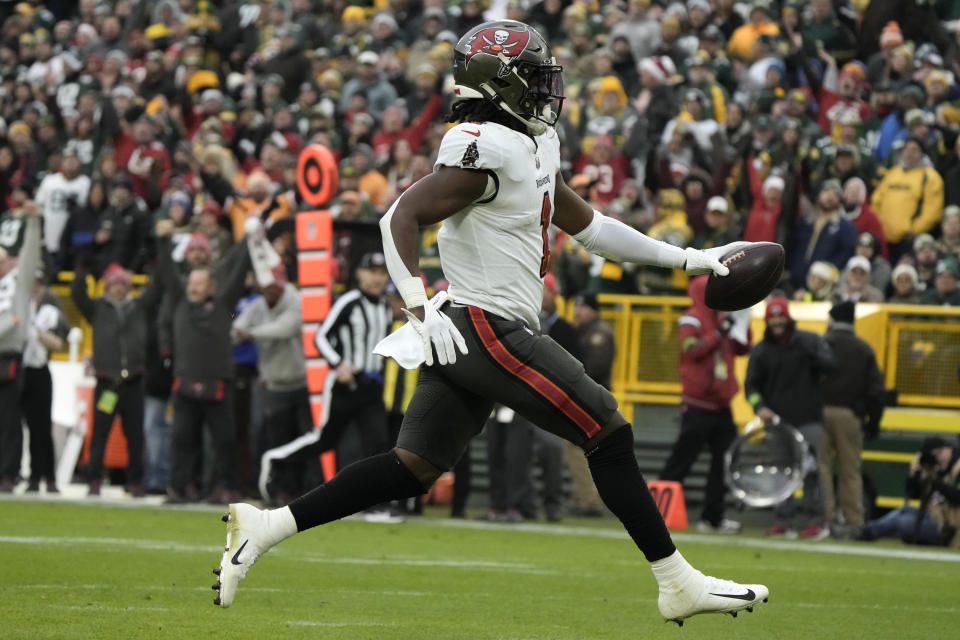 Tampa Bay Buccaneers running back Rachaad White (1) scores on a 26-yard touchdown reception during the second half of an NFL football game against the Green Bay Packers, Sunday, Dec. 17, 2023, in Green Bay, Wis. (AP Photo/Morry Gash)
