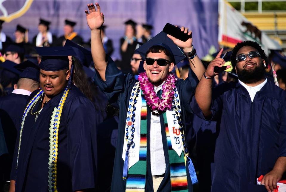 Merced College graduate Nate Ruiz, center, finds some familiar faces in the crowd during Merced College’s comencement ceremony on Friday, May 26, 2023.