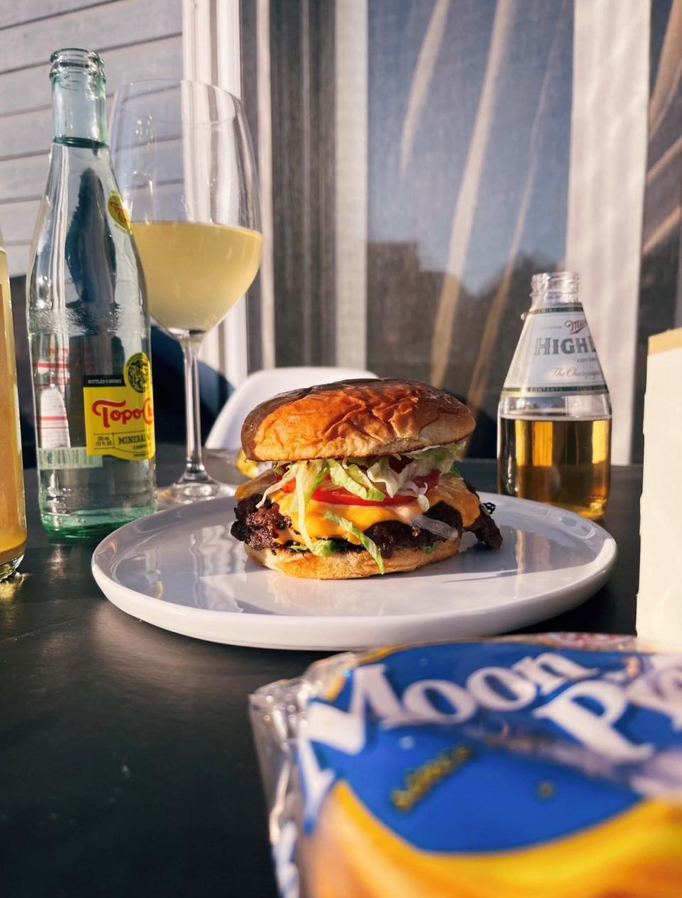 A burger from The Secret Smash Society.  Memphis chefs Cole Jeanes, Schuyler O’Brien and Harrison Downing host pop-ups at Memphis breweries featuring their over-the-top smashed burgers.