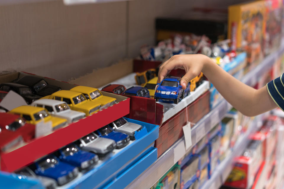 Boy choosing toy in the shop