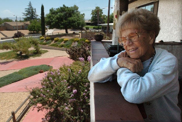 Doris Davies laughs as she talks about having Pebble Beach Park in Victorville renamed in honor in a ceremony while at her home in Victorville.