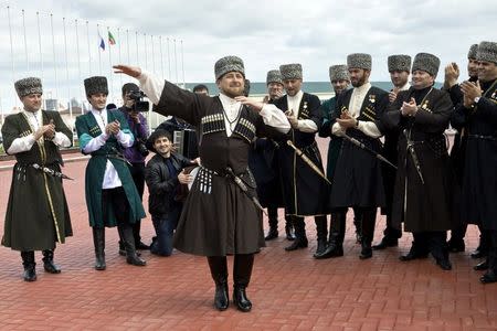 Chechen leader Ramzan Kadyrov (front), dressed in a national costume, performs during celebrations dedicated to the Chechen Language Day in Grozny, in Chechnya, Russia, in this April 25, 2011 file picture. REUTERS/Stringer/Files