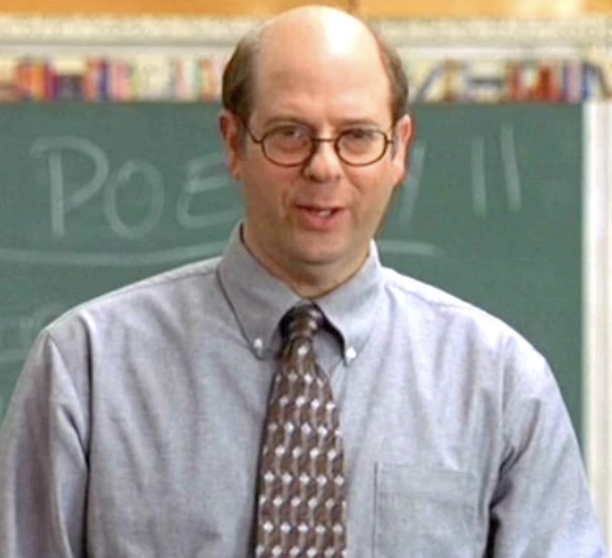 a man wearing glasses and a tie