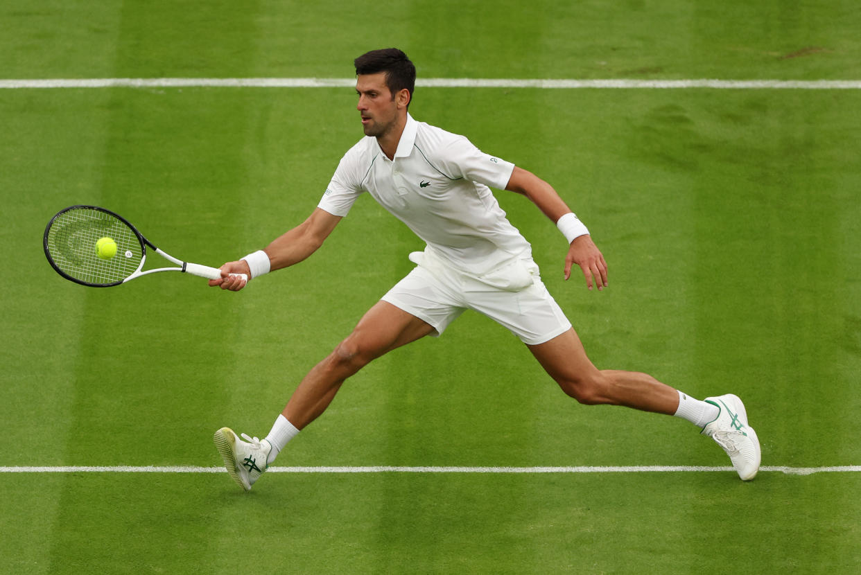 LONDON, ENGLAND - JUNE 27: Novak Djokovic of Serbia plays a forehand against Soonwoo Kwon of South Korea during the Men's Singles First Round match during Day One of The Championships Wimbledon 2022 at All England Lawn Tennis and Croquet Club on June 27, 2022 in London, England. (Photo by Julian Finney/Getty Images)