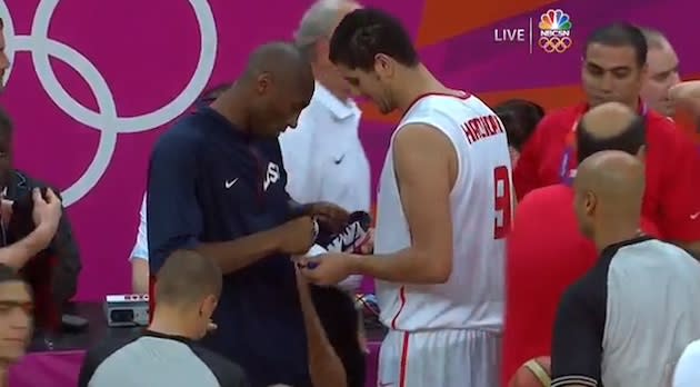 Kobe Bryant signs the shoe of Tunisian forward Mohamed Hdidane — NBC Sports Network screenshot