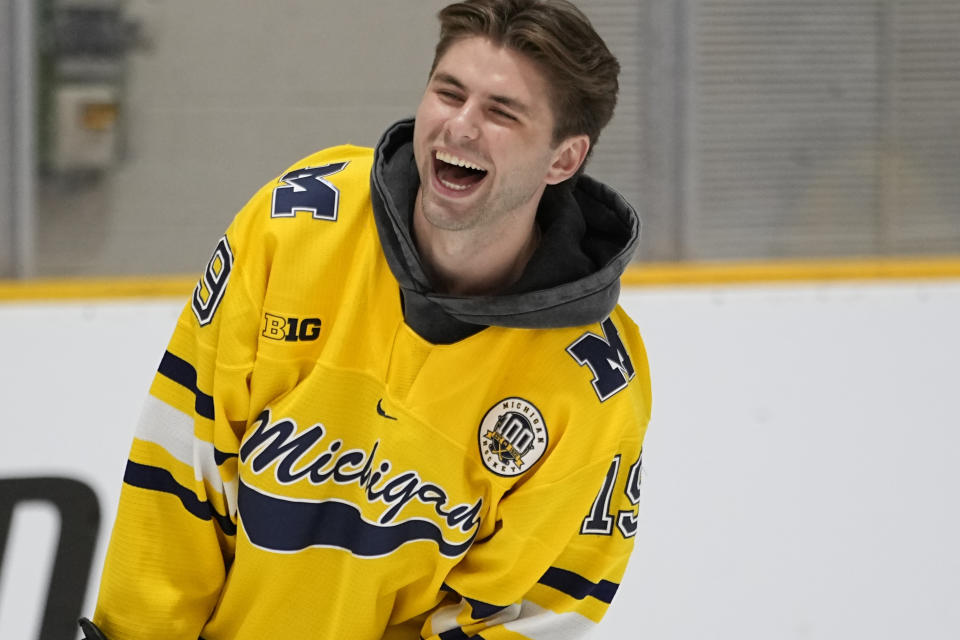 NHL draft prospect Adam Fantilli laughs during a youth hockey clinic with other draft prospects and members of the NHL Player Inclusion Coalition, Tuesday, June 27, 2023, in Nashville, Tenn. (AP Photo/George Walker IV)