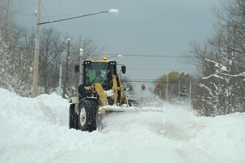 A National Guard loader clears a road Nov. 19, 2022, after an intense lake-effect snowstorm hit the area.