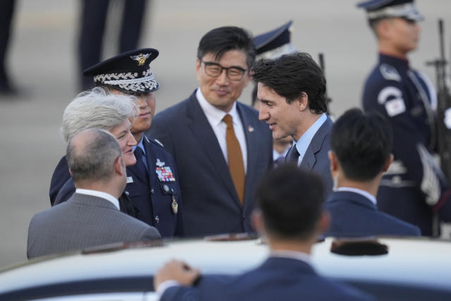 Canadian Prime Minister Justin Trudeau, center right, is welcomed upon his arrival at the Seoul airport in Seongnam, South Korea, Tuesday, May 16, 2023. Trudeau arrived Tuesday in South Korea and will meet with South Korean President Yoon Suk Yeol, before heading to Japan for G7 summit. (AP Photo/Lee Jin-man)