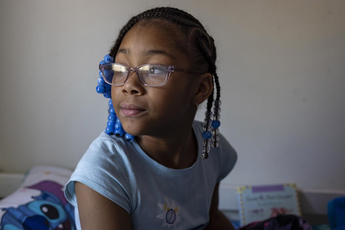 Ke'Arrah Jessie, 9, sits for a portrait in her bedroom in Niagara Falls, N.Y., on Monday, April 3, 2023. Ke’Arrah spent more than a year learning remotely early in the pandemic. Her mother, Ashley Martin, could see the toll on her daughter’s drive to learn. (AP Photo/Lauren Petracca)