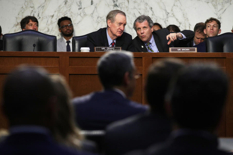 WASHINGTON, DC - JULY 16:  Committee chairman Sen. Mike Crapo (R-ID) (L) listens to ranking member Sen. Sherrod Brown (D-OH) (R) during a hearing before Senate Banking, Housing and Urban Affairs Committee July 16, 2019 on Capitol Hill in Washington, DC. The committee held the hearing on "Examining Facebook's Proposed Digital Currency and Data Privacy Considerations."  (Photo by Alex Wong/Getty Images)