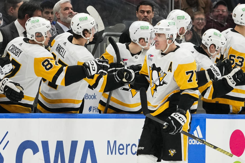 Pittsburgh Penguins' Evgeni Malkin (71) celebrates with teammates after scoring a goal against the New York Islanders during the second period of an NHL hockey game Wednesday, Dec. 27, 2023, in Elmont, N.Y. (AP Photo/Frank Franklin II)