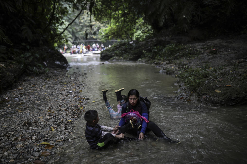 Venezuelan migrants rest during their walk across the Darien Gap from Colombia to Panama in hopes of reaching the U.S., Tuesday, May 9, 2023. Pandemic-related U.S. asylum restrictions, known as Title 42, are to expire Thursday, May 11. (AP Photo/Ivan Valencia)