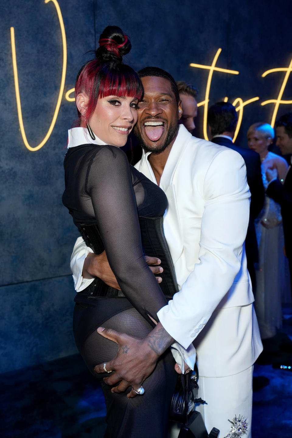 Jennifer Goicoechea and Usher attend the 2023 Vanity Fair Oscar Party.