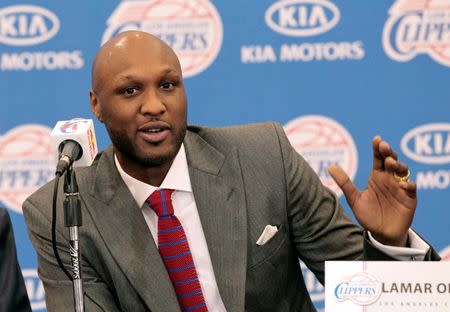 Basketball player Lamar Odom speaks at a news conference announcing his acquisition by the Los Angeles Clippers in Los Angeles, California in this July 2, 2012 file photo. REUTERS/Mario Anzuoni/Files