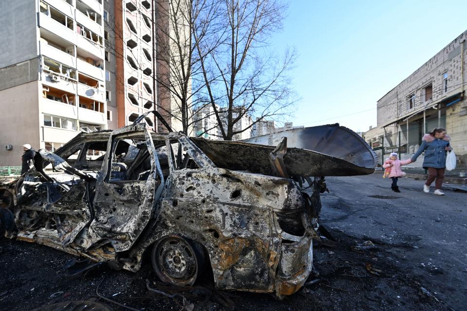 TOPSHOT - A view of the car which was destroyed by recent shelling in Kyiv outskirts on February 28, 2022. - The UN human rights chief said on February 28, 2022 that at least 102 civilians, including seven children, had been killed in Ukraine since Russia launched its invasion five days ago, warning the true numbers were likely far higher. (Photo by Genya SAVILOV / AFP) (Photo by GENYA SAVILOV/AFP via Getty Images)