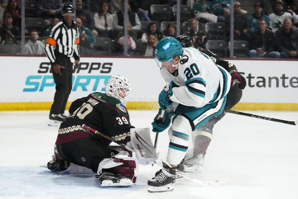 Arizona Coyotes goaltender Connor Ingram (39) makes a save on a shot by San Jose Sharks left wing Fabian Zetterlund (20) during the second period of an NHL hockey game Friday, Dec. 15, 2023, in Tempe, Ariz. (AP Photo/Ross D. Franklin)
