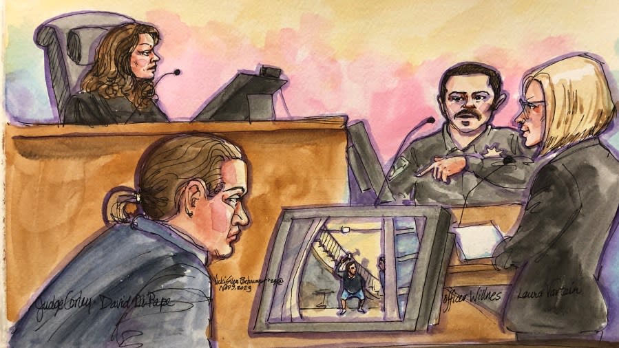 David DePape views an SFPD officer’s body camera video showing the hammer attack against Paul Pelosi. (Courtroom sketch by Vicki Behringer)