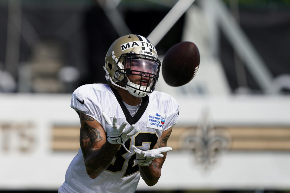 New Orleans Saints safety Tyrann Mathieu (32) catches the ball during training camp at their NFL football training facility in Metairie, La., Thursday, Aug. 4, 2022. (AP Photo/Gerald Herbert)