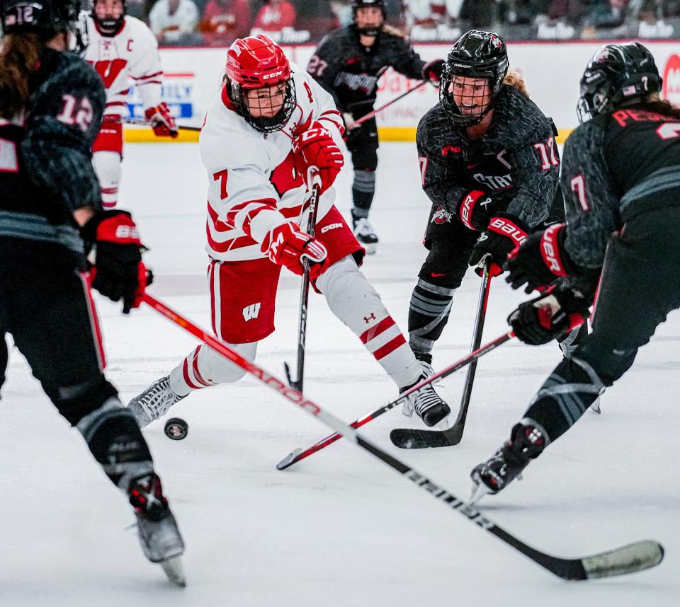 Jesse Compher (center) and the Wisconsin Badgers will face Long Island University in the opening round of the NCAA Tournament Thursday.