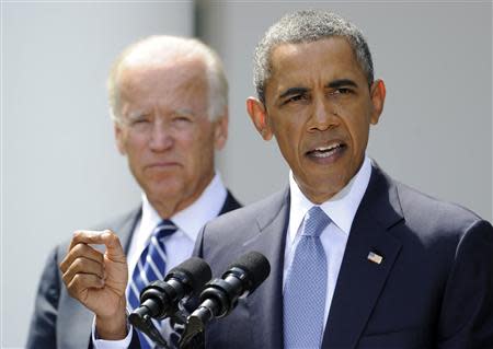 U.S. President Barack Obama speaks about Syria next to Vice President Joe Biden (L) at the Rose Garden of the White House August 31, 2013, in Washington. REUTERS/Mike Theiler