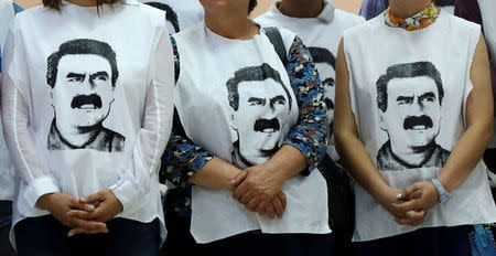 FILE PHOTO: Pro-Kurdish politicians wearing t-shirts featuring Abdullah Ocalan gather to start a hunger strike to demand the right to visit the jailed PKK militant leader Ocalan, in Diyarbakir, Turkey, September 5, 2016. REUTERS/Sertac Kayar/File Photo