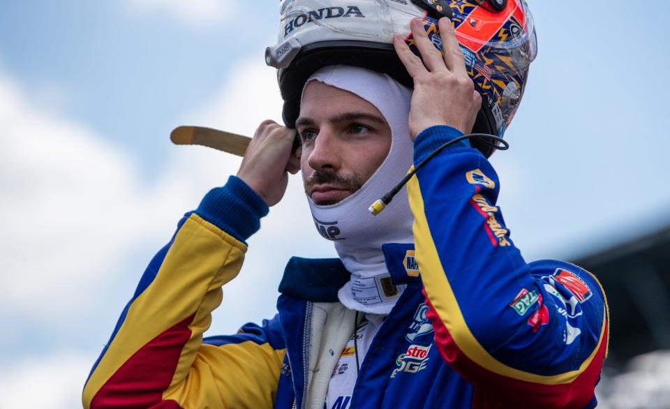 Alexander Rossi (27) puts his helmet on before the Fast Nine Shootout for the 2020 Indianapolis 500.