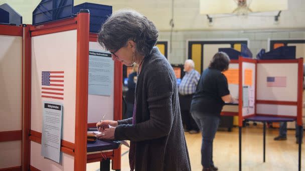 PHOTO: In this May 3, 2022, file photo, a voter fills in her ballot during primary voting at Central Elementary School in Kent, Ohio. (Jeff Swensen/Getty Images, FILE)