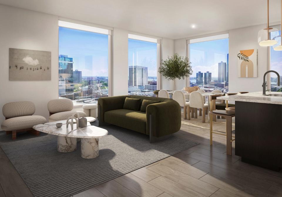 A rendering provided by Exchange Detroit shows a kitchen and living space in one of the condominiums in the Exchange which opens in July of 2023.