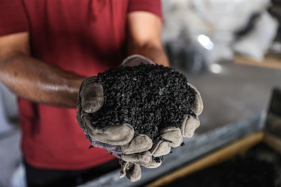 gazan man collects waste vehicle tires and reuses them