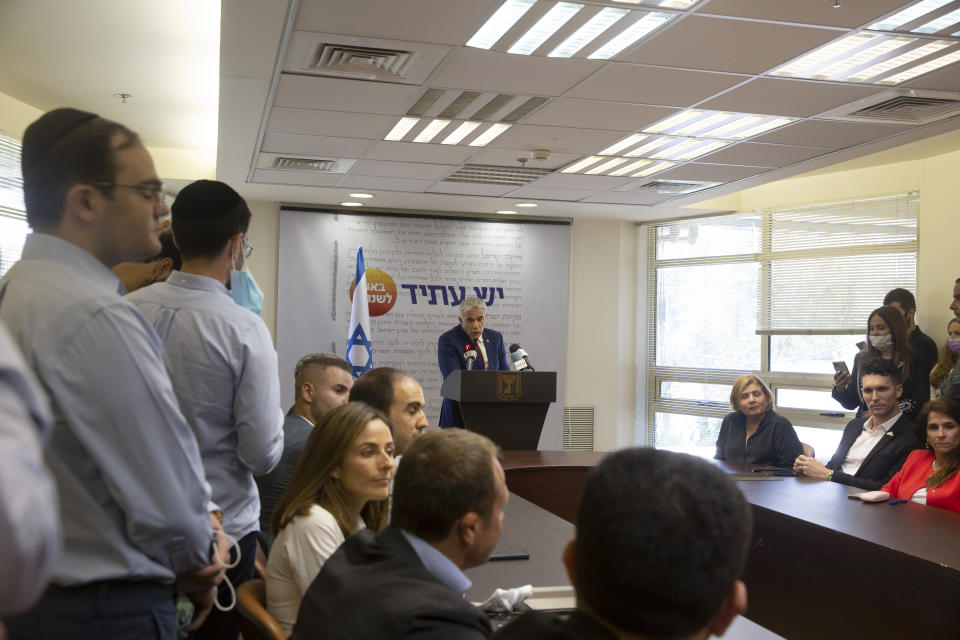 Yesh Atid party leader Yair Lapid speaks to journalists at the Knesset, Israel's Parliament, Monday, June 7, 2021. (AP Photo/Maya Alleruzzo)