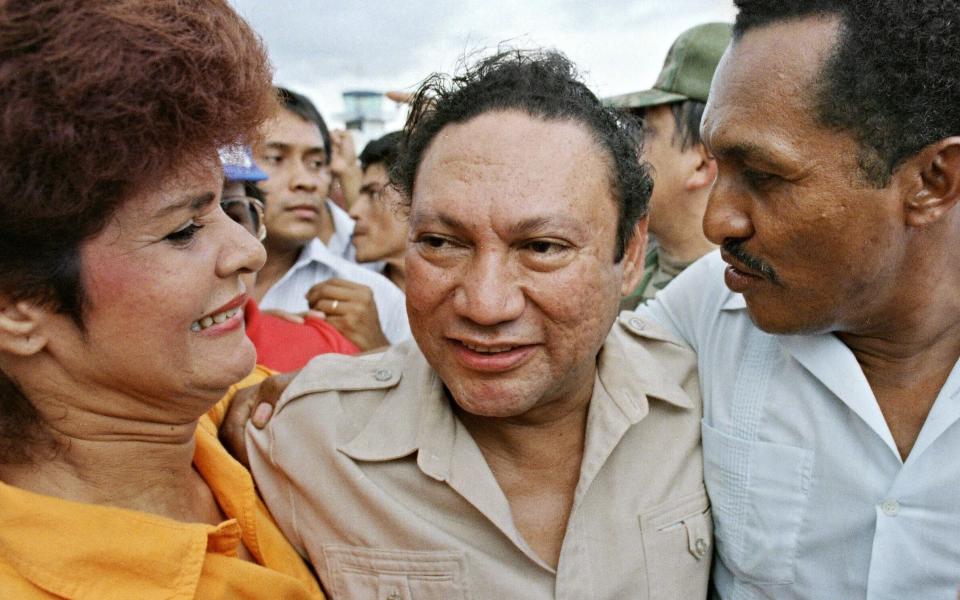 General Manuel Noriega, surrounded by his supporters at the height of his power in 1987 - Credit: AFP