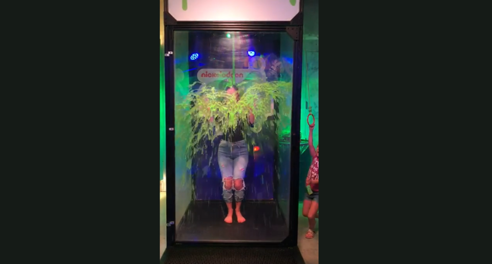 Mom Alayne Toledano gets slimed at Slime City in a VIP booth