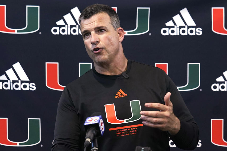 FILE - Miami head coach Mario Cristobal speaks after the team's NCAA football practice in Coral Gables, Fla., Friday, Aug. 5, 2022. Cristobal is taking over in his first season as Miami's coach with a team that is the preseason Coastal Division favorite. (AP Photo/Marta Lavandier, File)