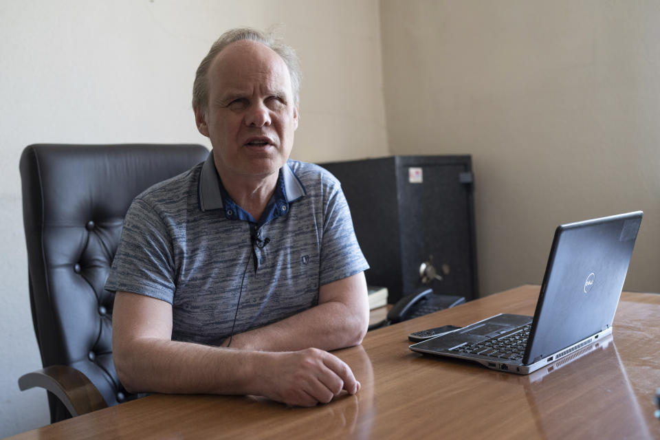 Oleksandr Vinkovskyi, director of a Kyiv manufacturing plant where visually impaired people worked, sits for an interview in Kyiv, Ukraine, May 30, 2023, about the impacts of Russian attacks on his employees. "A visually impaired person goes to work not only to earn money, but also to communicate, interact, and be part of society in some way," said Vinkovskyi. "And I don't know how to estimate this loss." (AP Photo/Roman Hrytsyna)